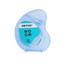 A blue and white package of WOOM Ortho Dental Floss designed for braces and orthodontics.