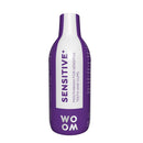 A bottle of mouthwash labeled 'SENSITIVE+' by WOOM, indicating it is formulated for sensitive teeth and gums.