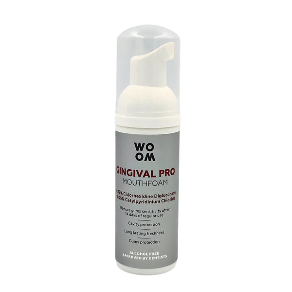 A bottle of WOOM GINGIVAL PRO mouth foam with a white dispenser designed for oral care.