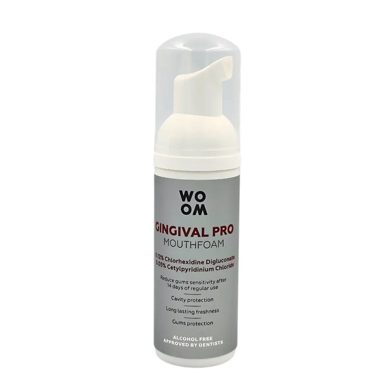 A bottle of WOOM GINGIVAL PRO mouth foam with a white dispenser designed for oral care.