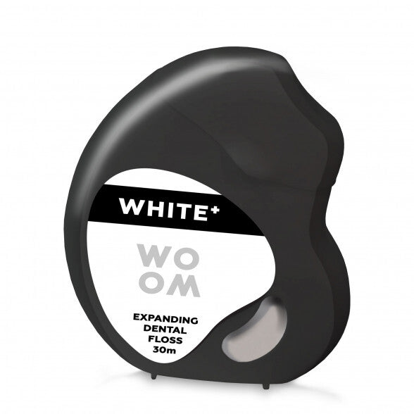 A black and white package of WOOM White Dental Floss, featuring an expanding dental floss design.