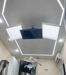Ceiling with LED shadowless lights and LCD screen in a dental office. room