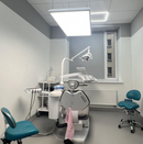 Dental clinic room with dental equipment and chairs with a shadowless lamp by Pro Max Dental
