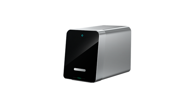 Silver dental device with black front panel on a white background