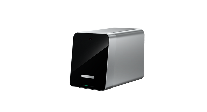 Silver dental device with black front panel on a white background