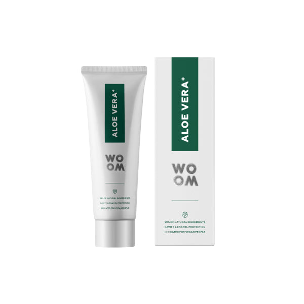 A tube of WOOM ALOE VERA+ toothpaste next to its packaging box, both featuring green and white color schemes.