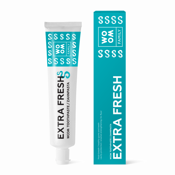 A tube of toothpaste labeled 'EXTRA FRESH' alongside its packaging box, both featuring blue and white color schemes with the brand name 'WOOM' displayed.