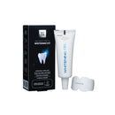 A teeth whitening kit by WOOM, including a tube of whitening gel and a silicone mouth tray, displayed alongside its packaging.