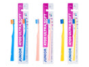 Packaging of three JUNIOR ULTRA SOFT toothbrushes with different handle colors (blue, pink, and yellow).