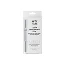 A teeth whitening pen by WOOM in its packaging, with information about the product visible on the front.