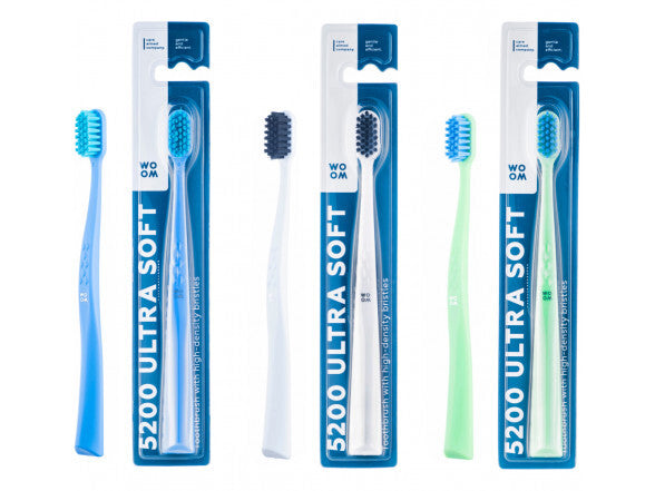 A set of three toothbrushes with ergonomic triangle handles in blue and green colors, featuring ultra soft bristles for gentle gum stimulation.